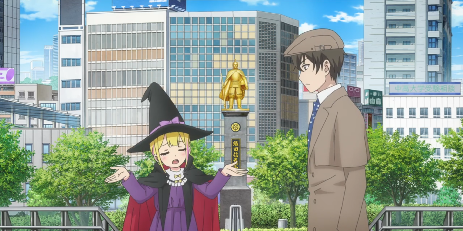 Sousuke and Sara in Halloween costumes - Sara as a witch, Sousuke as a detective - talk near a golden statue, while Sara's arms are outstretched in resignation.