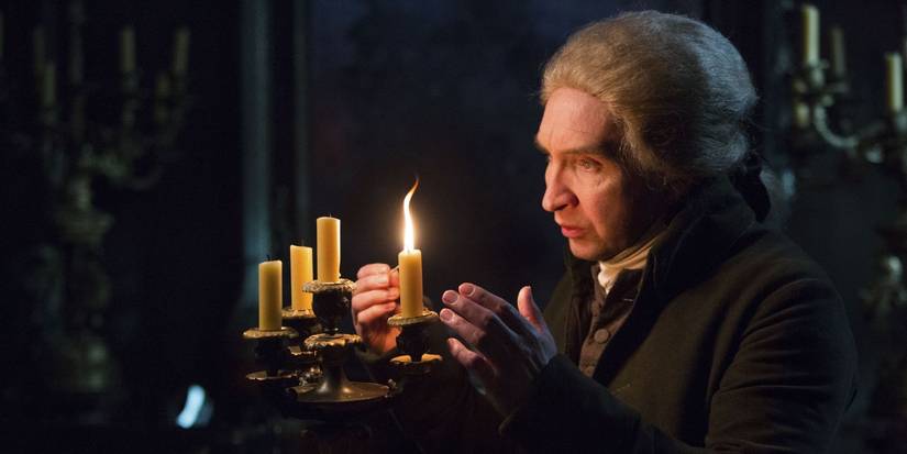 Eddie Marsan as Mr. Norrell lighting a candle in Jonathan Strange and Mr. Norrell
