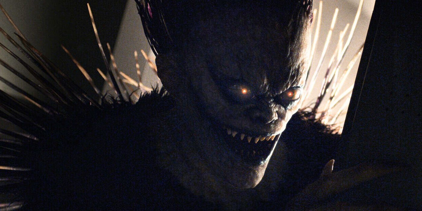 Shinagami backlit with glowing eyes in the live-action Death Note movie