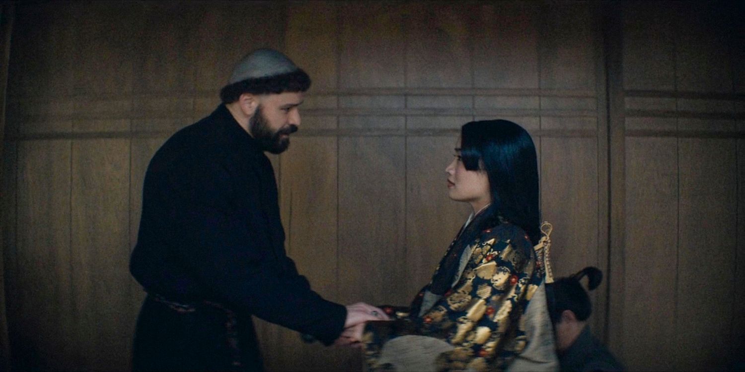 Father Martin takes Mariko's hands in Shogun season 1 ep 8