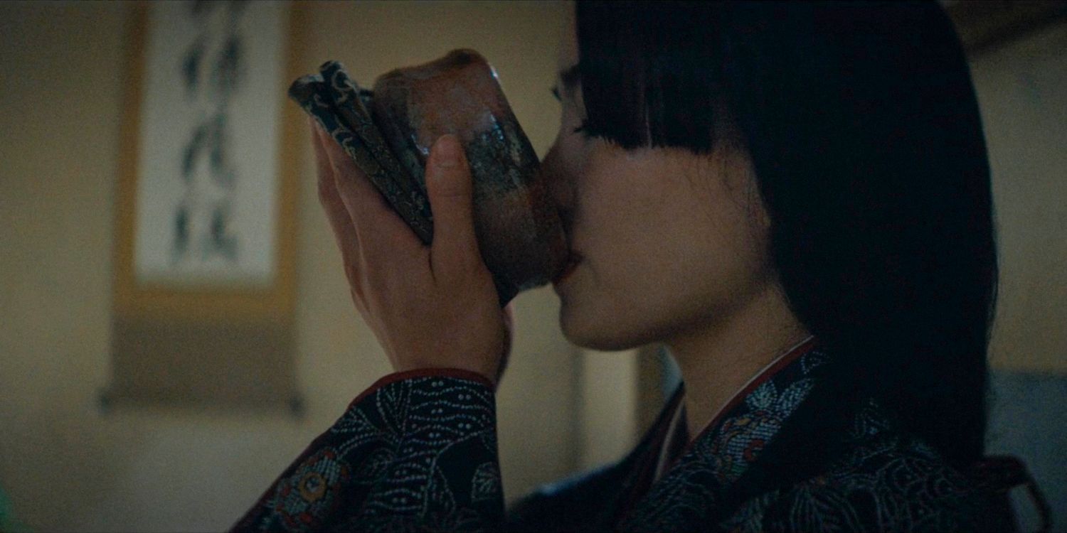 Close up of Mariko in profile, drinking tea in Shogun season 1 ep 8