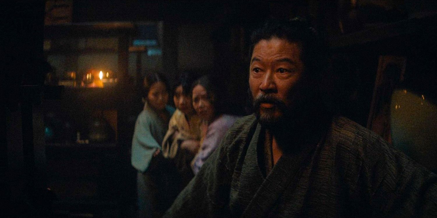 Yabushige with a surprised expression protects some women behind him in Shogun season 1 Ep 9 