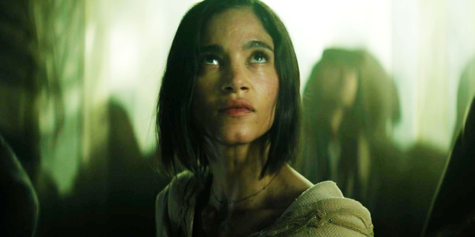 Sofia Boutella as Kora looking up in Rebel Moon Part One A Child of Fire