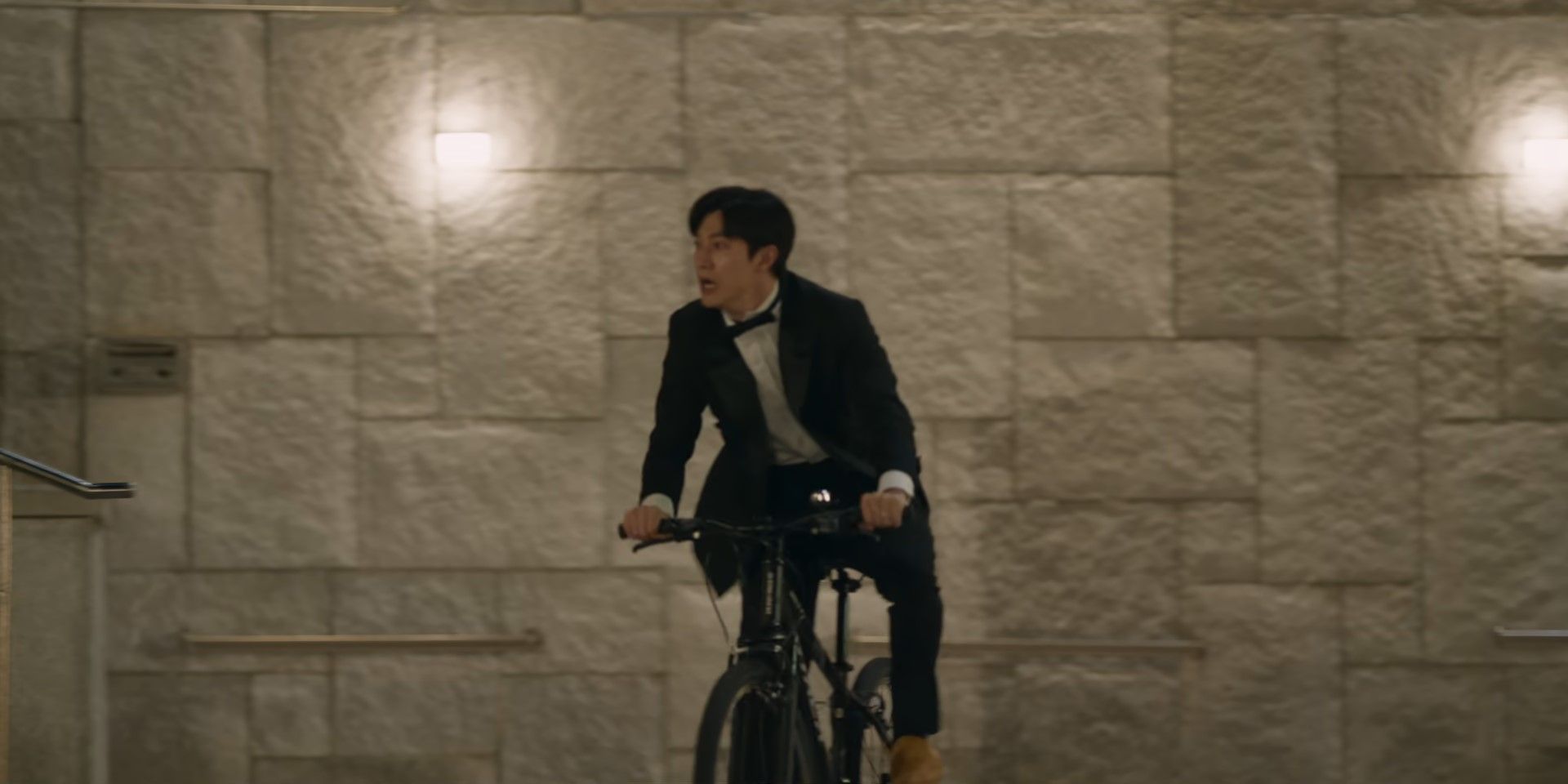Soocheol rides a bike while crying in Queen of Tears
