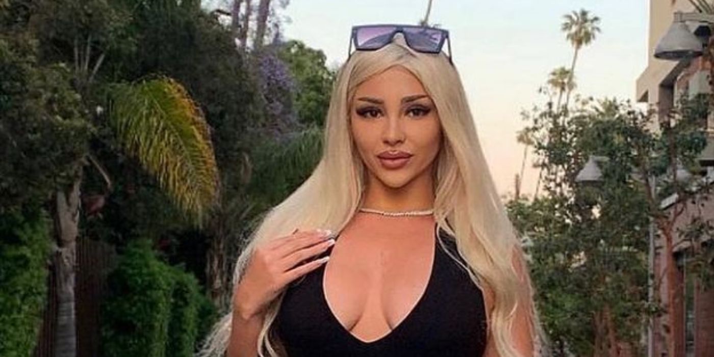Sophie Sierra In 90 Day Fiance posing outdoors with black top