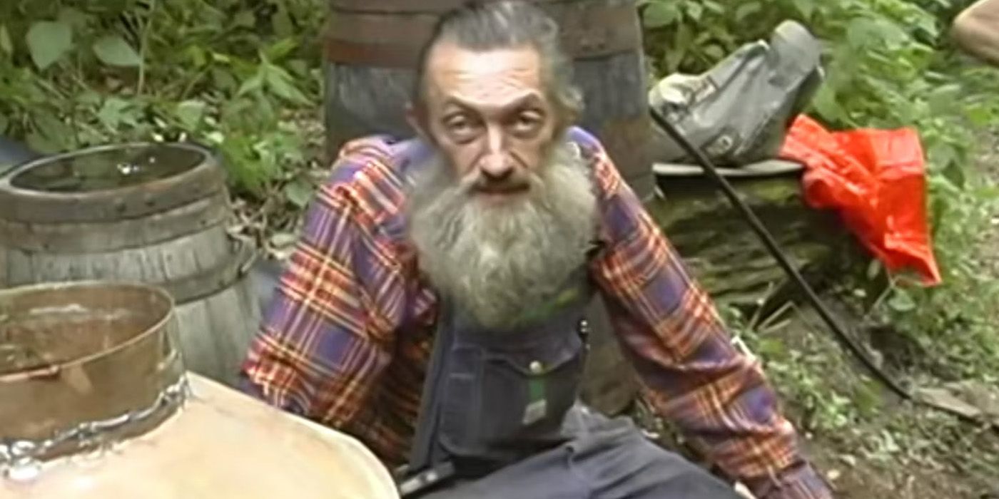Sutton sitting outside on Moonshiners