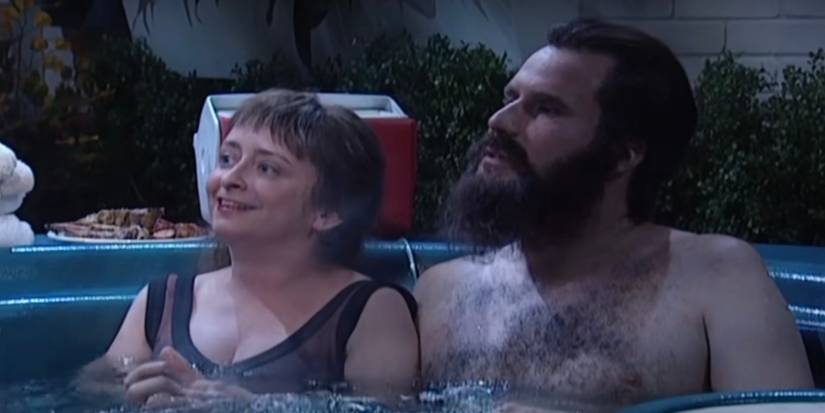 Rachel Dratch and Will Ferrell are sitting in a hot tub.