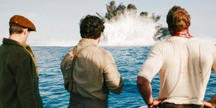 Henry Hayes, Gus March-Phillips, and Anders Lassen watching the explosion of a boat at sea in The Ministry of Ungentlemanly Warfare