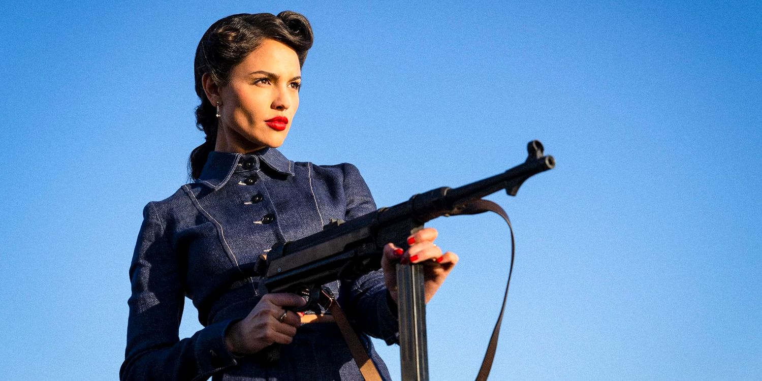 Eiza González as Marjorie Stewart holding an assault rifle in The Ministry of Ungentlemanly Warfare