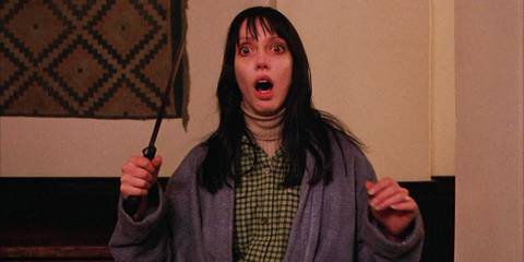 Wendy (Shelley Duvall) looking scared and holding a knife in The Shining
