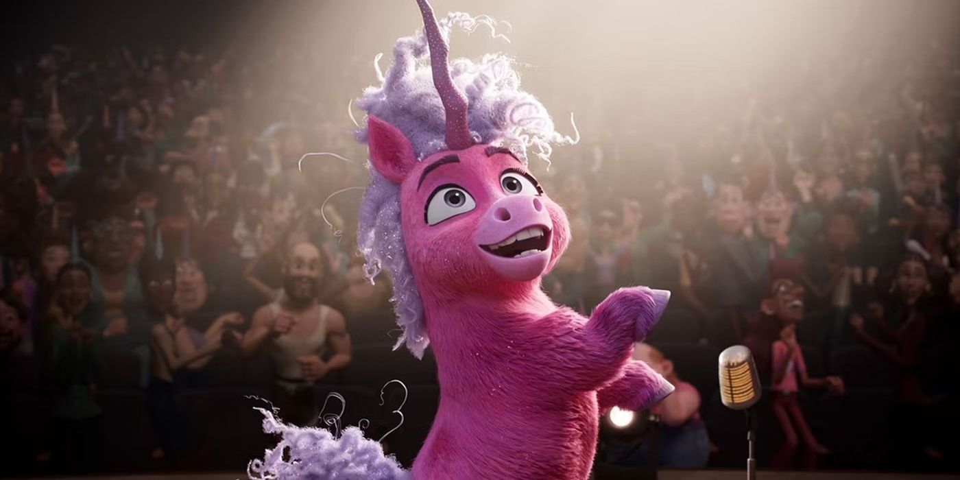 Thelma The Unicorn singing on stage to a crowd