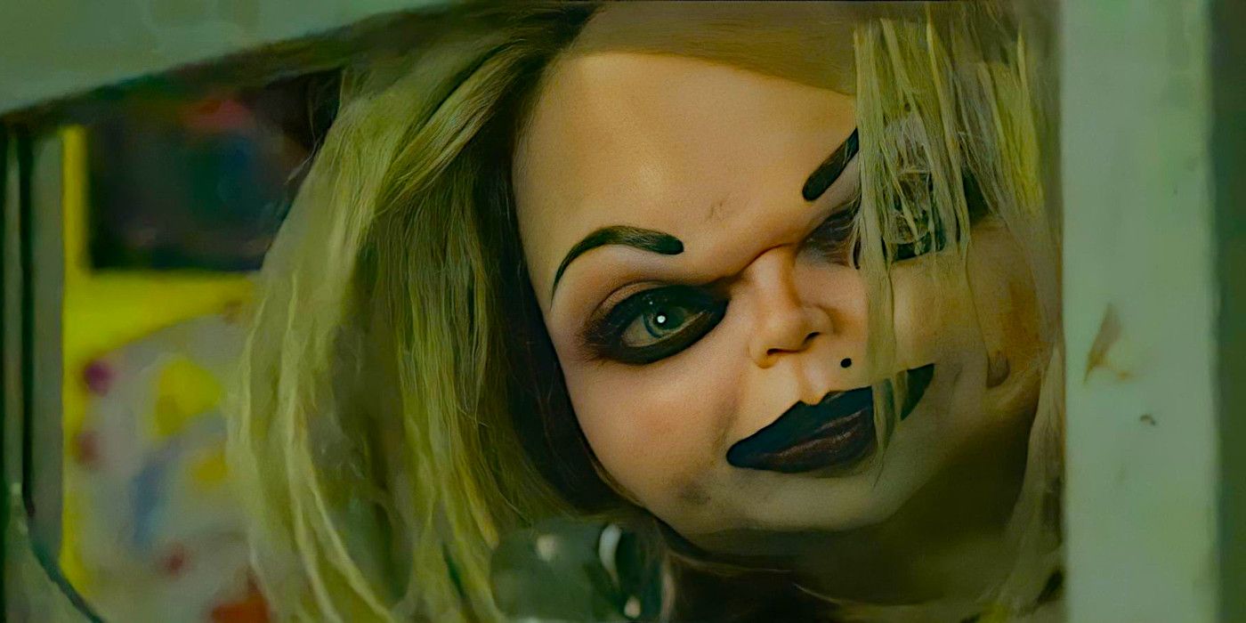 Tiffany Doll peers at something while wearing a sinister expression in a scene from Chucky