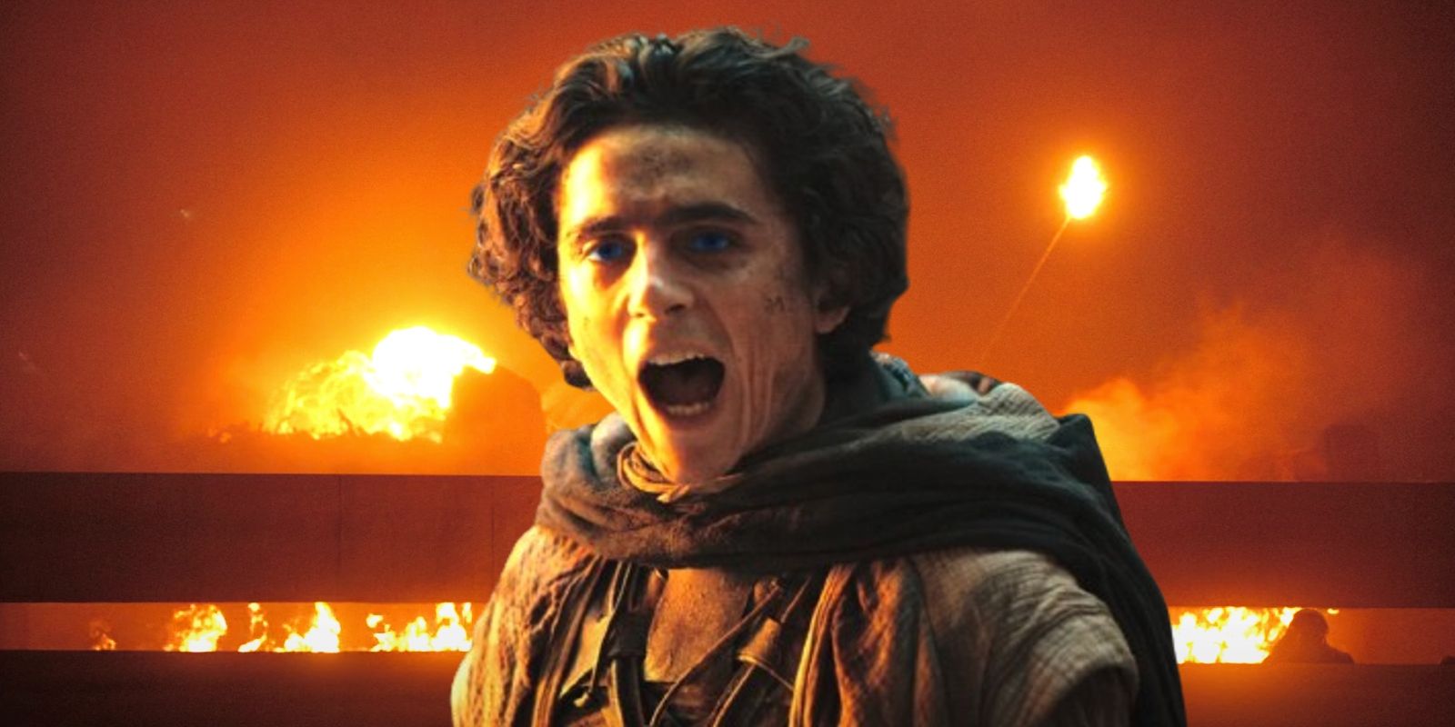 Timothée Chalamet yelling as Paul Atreides as explosions go off behind him in Dune Part Two