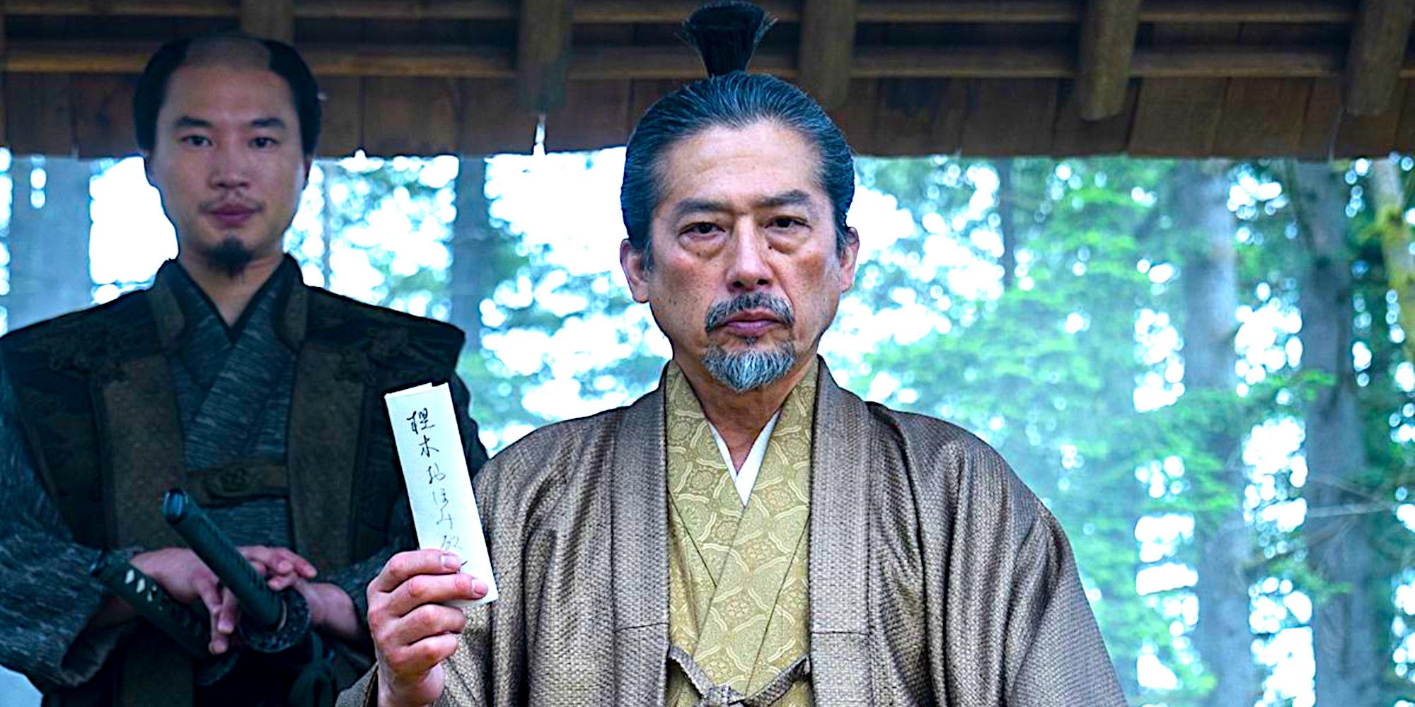 Toranaga holds up a document in a scene from Shogun episode 10