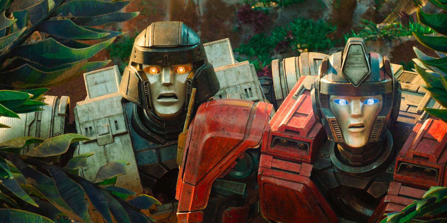 D-16 and Orion Pax, surprised, emerge from the vegetation in Transformers One.