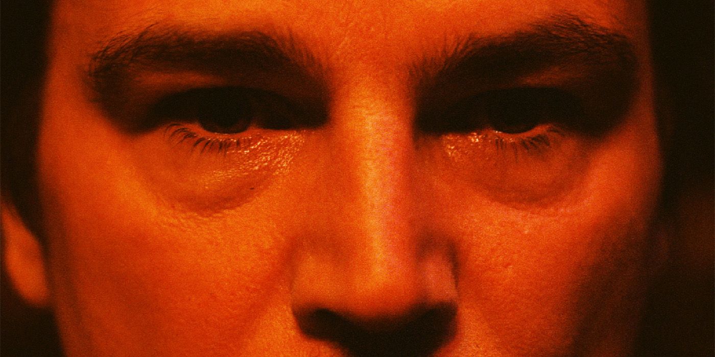 An extreme close-up of Josh Hartnett's eyes with a red filter in Trap 2024 