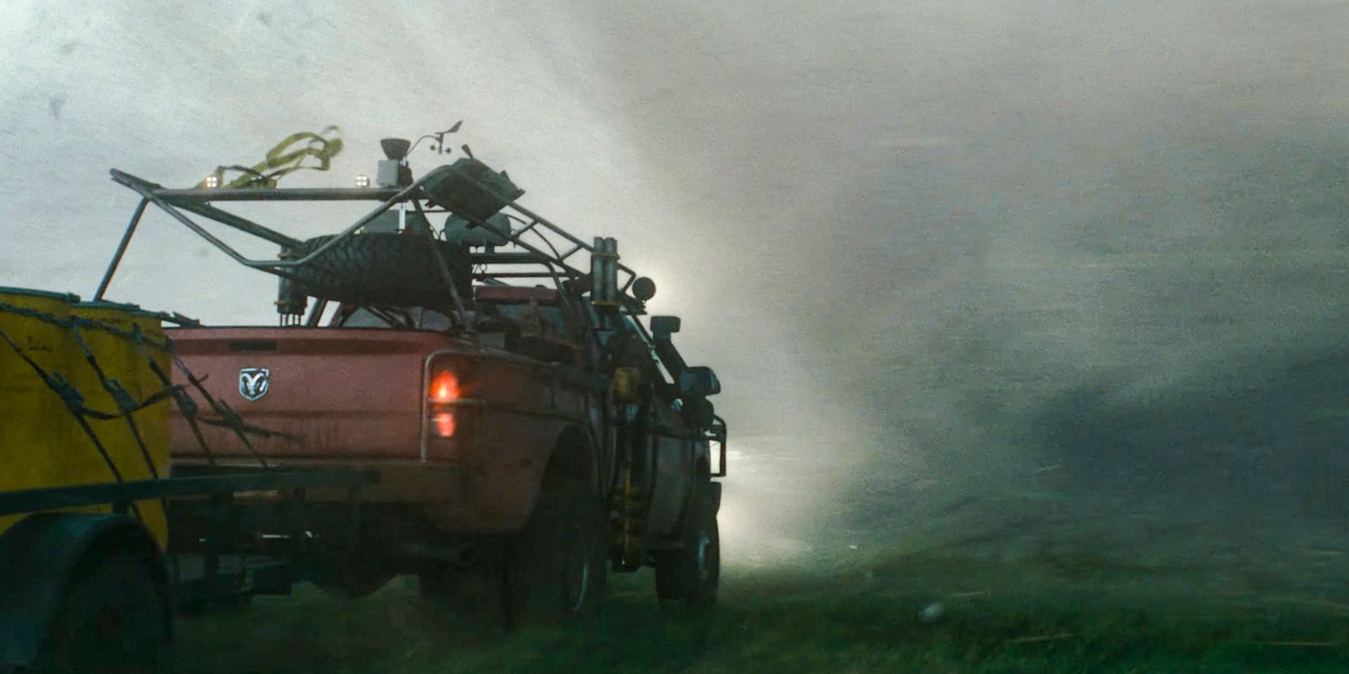 A pickup truck heading towards a tornado in Twisters (2024)