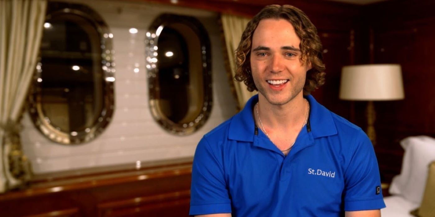 tyler walker smiles in a blue shirt during a confessional on below deck season 10