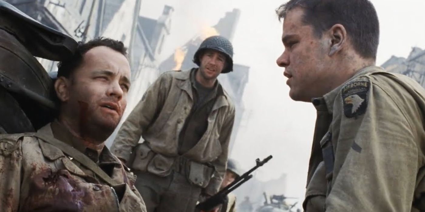 James Ryan (Matt Damon) looking at a bloody and injured Captain Miller (Tom Hanks) in Saving Private Ryan 