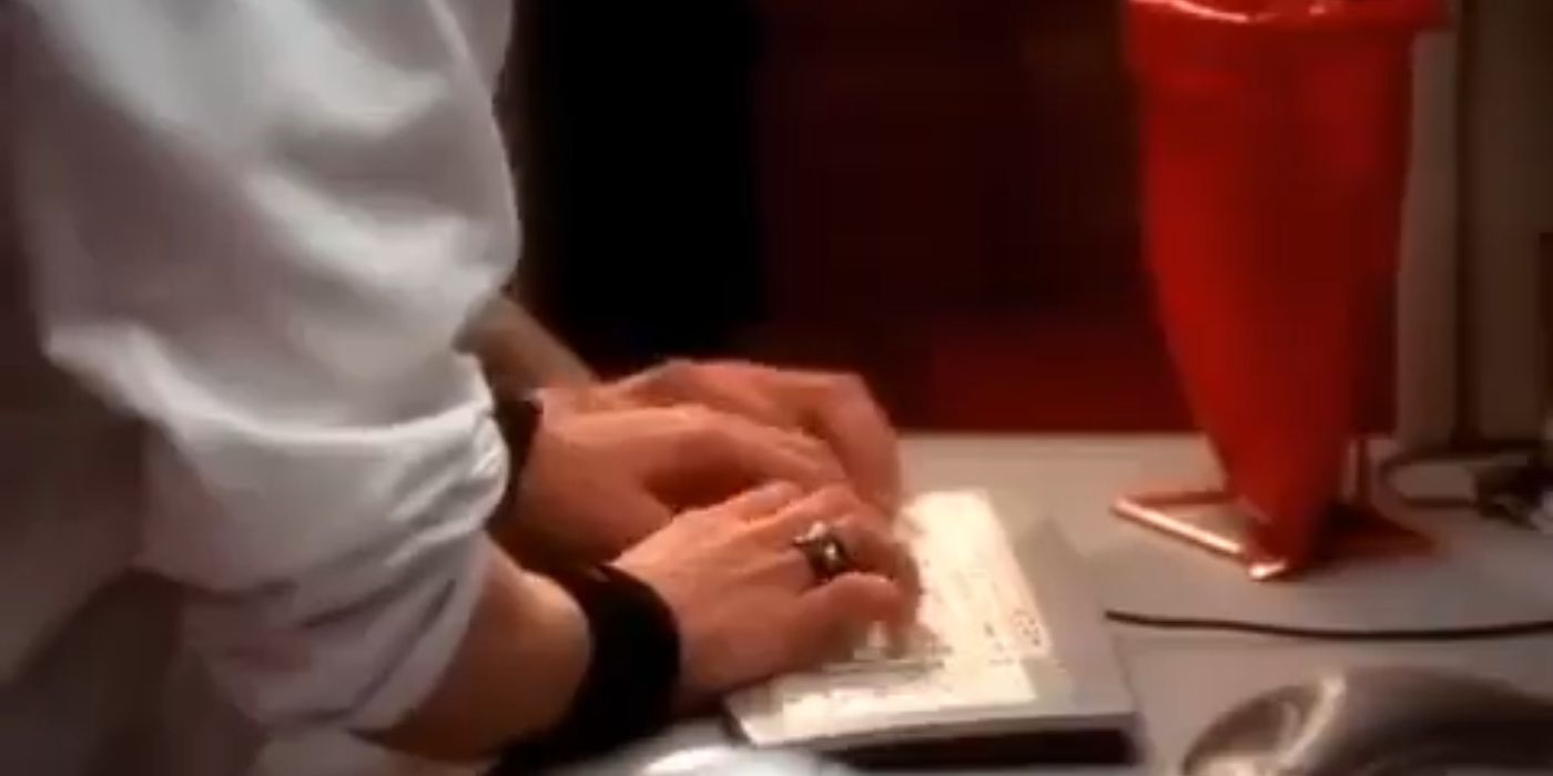 Abby and McGee typing on a computer in the NCIS episode The Bone Yard