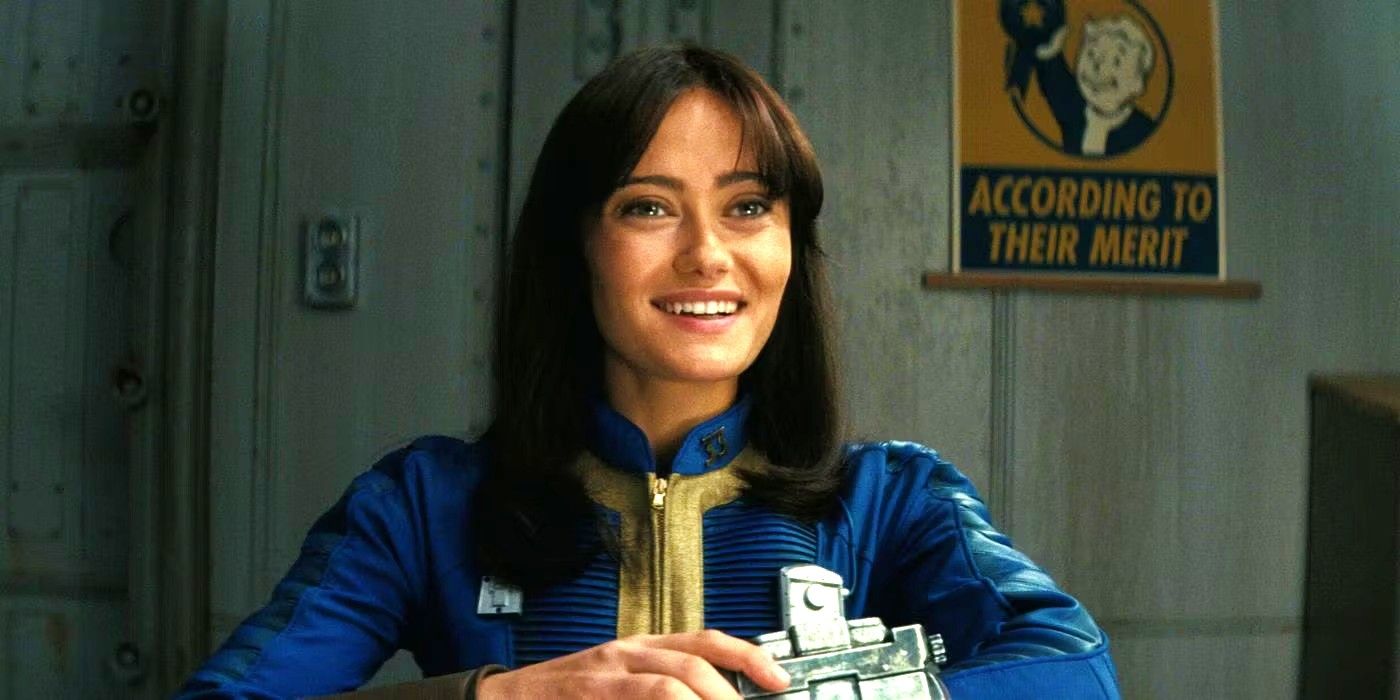 Ella Purnell as Lucy MacLean smiling while sitting at a table in the Fallout show