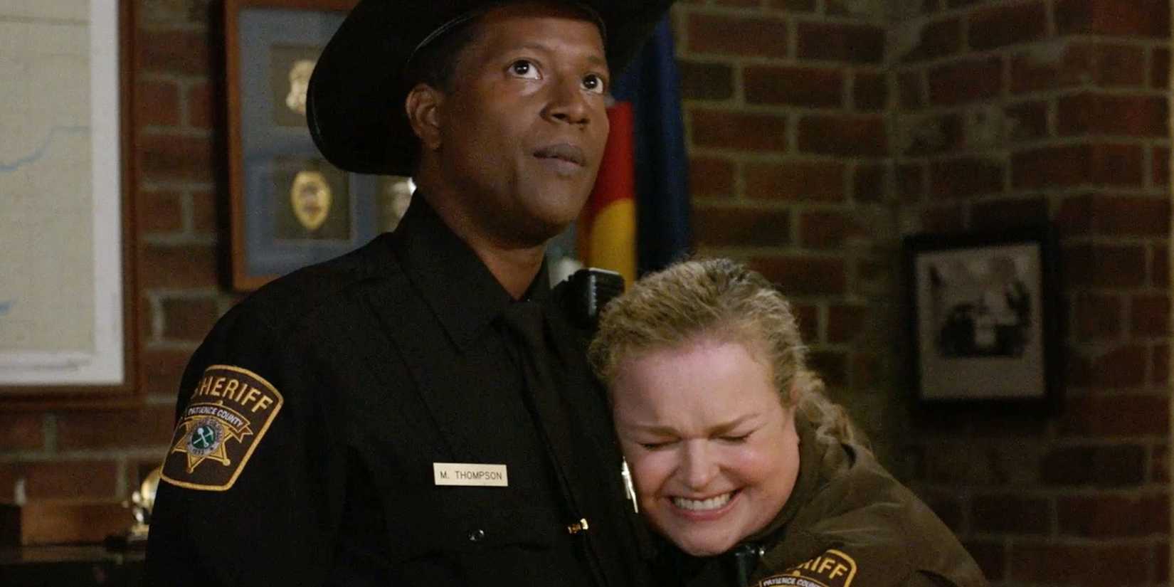 Liv hugging Mike in sheriff uniforms in Resident Alien