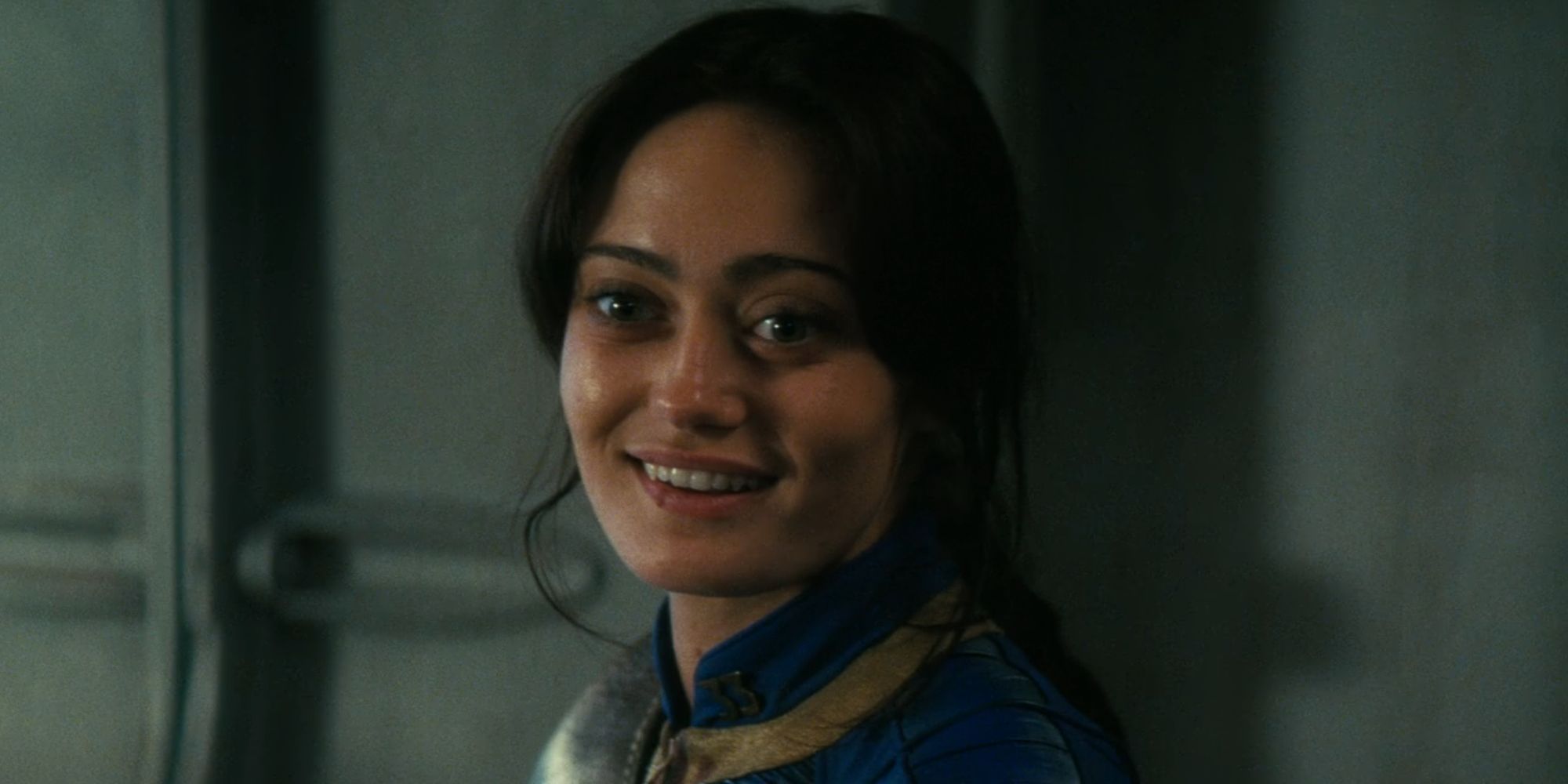 Ella Purnell smiling as Lucy MacLean in Fallout