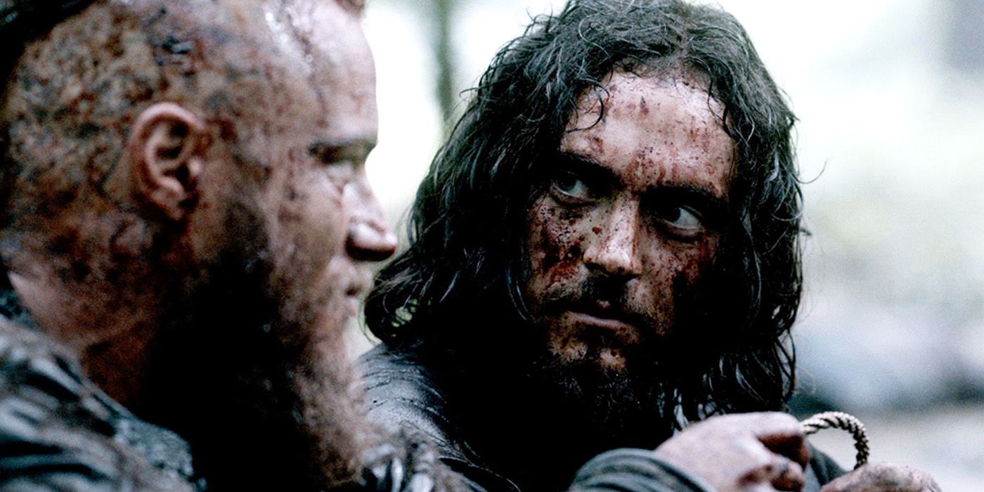 Vikings Athelstan covered in blood talking to Ragnar