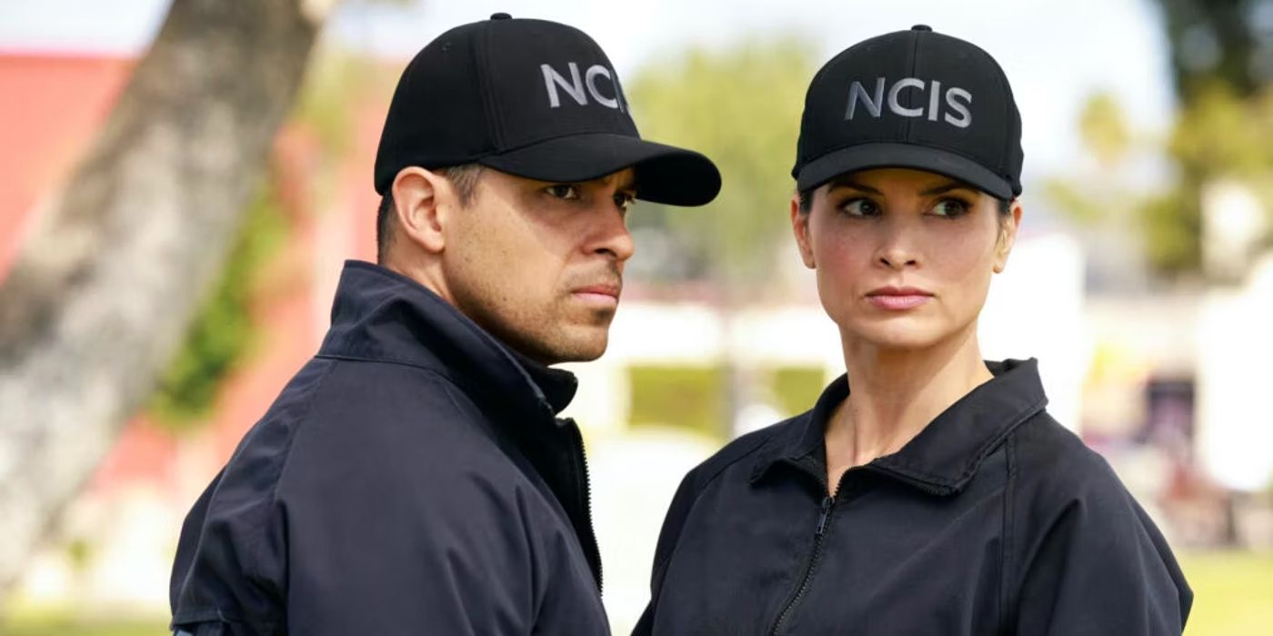 Agents Torres and Knight wear NCIS hats and stand together looking off screen.