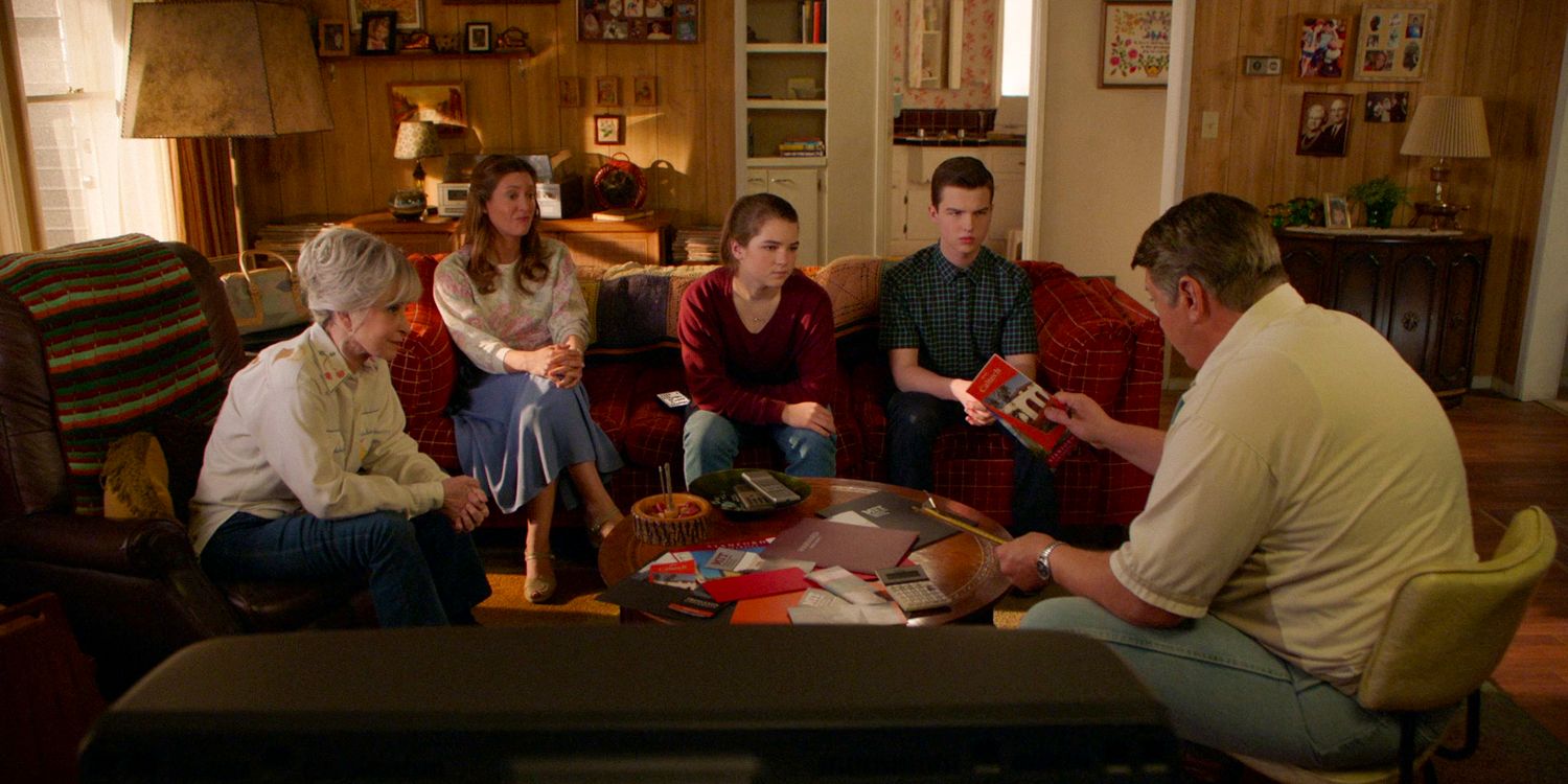 The Cooper family gathered in the living room listening to George Cooper talk about universities for Sheldo in Young Sheldon season 7 ep 9