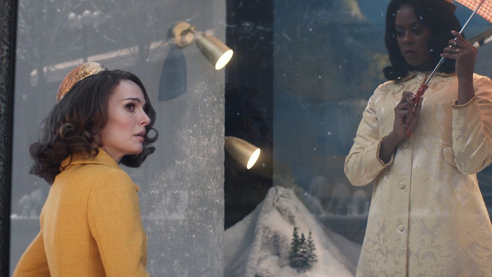 Natalie Portman in a yellow coat looking concerned in The Lady in the Lake