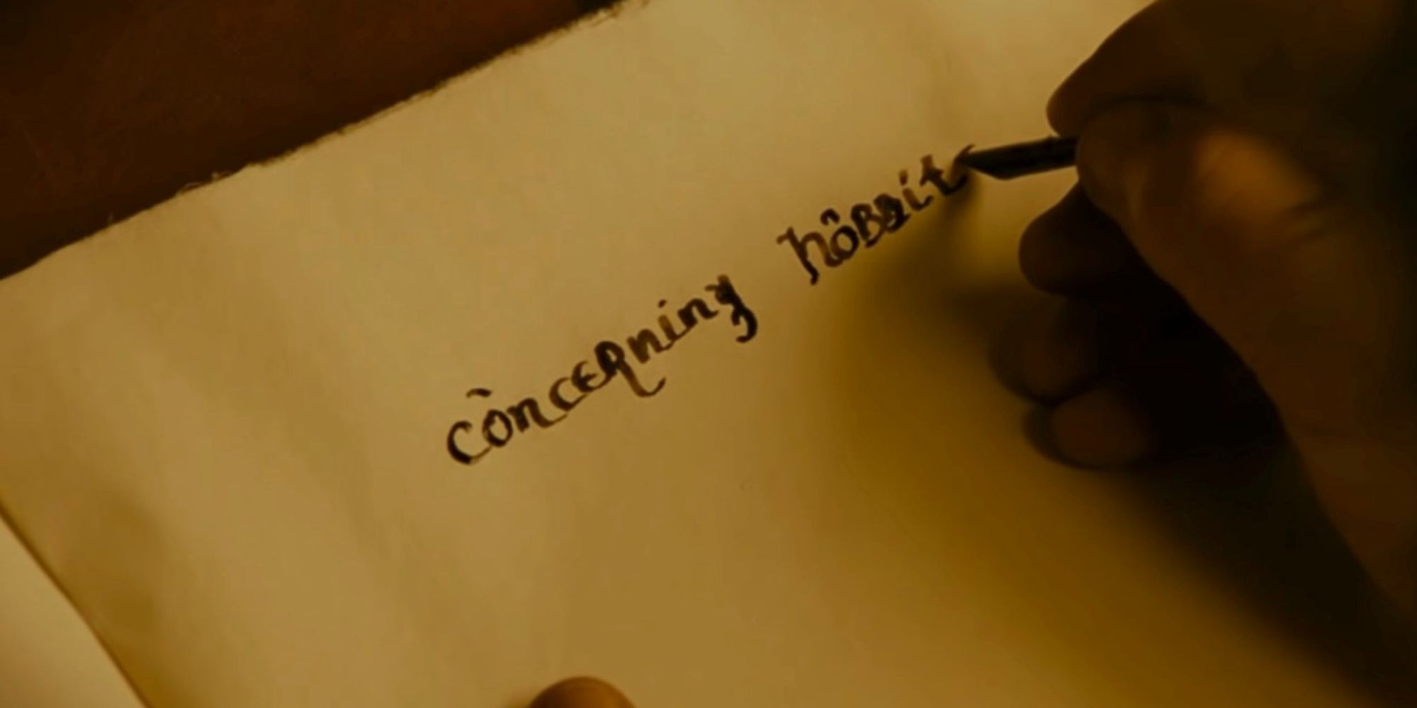 Bilbo writing concerning hobbits on a page in Fellowship of the Ring