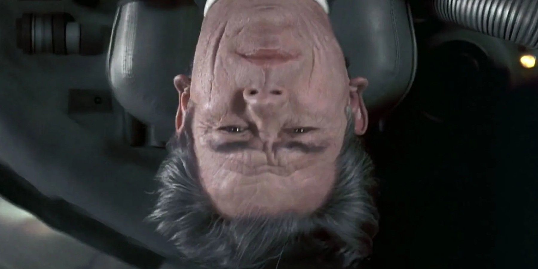 Tommy Lee Jones as Agent K upside down in his car in Men in Black