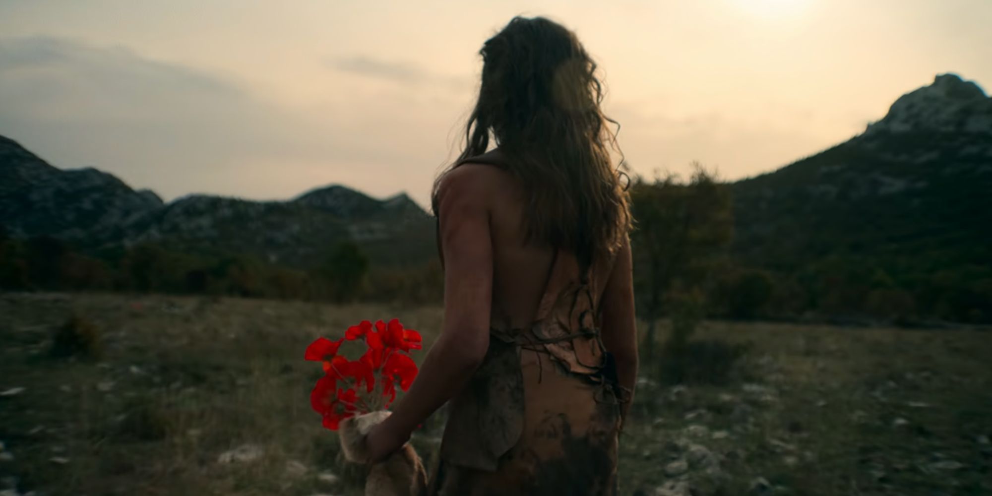 Neandertal carregando flores em Segredos dos Neandertais