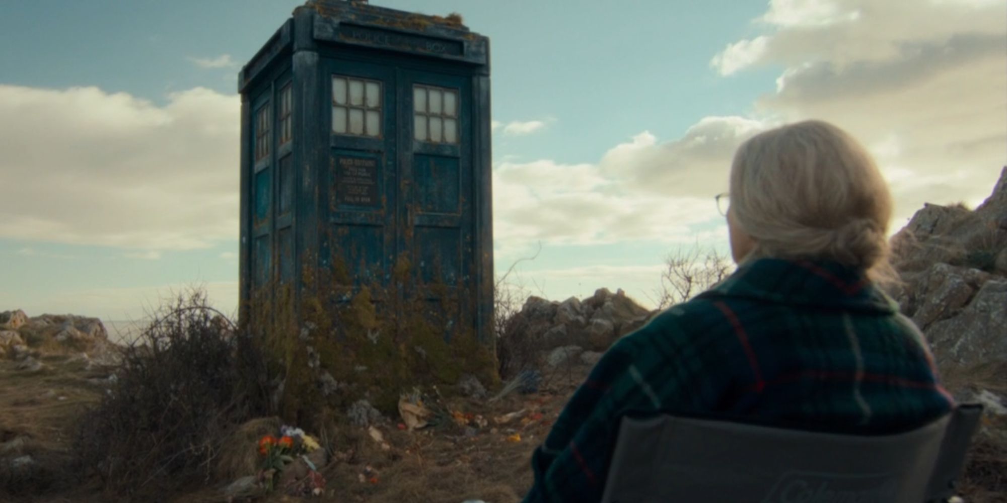 Old Ruby in a chair looking at the TARDIS in Doctor Who.