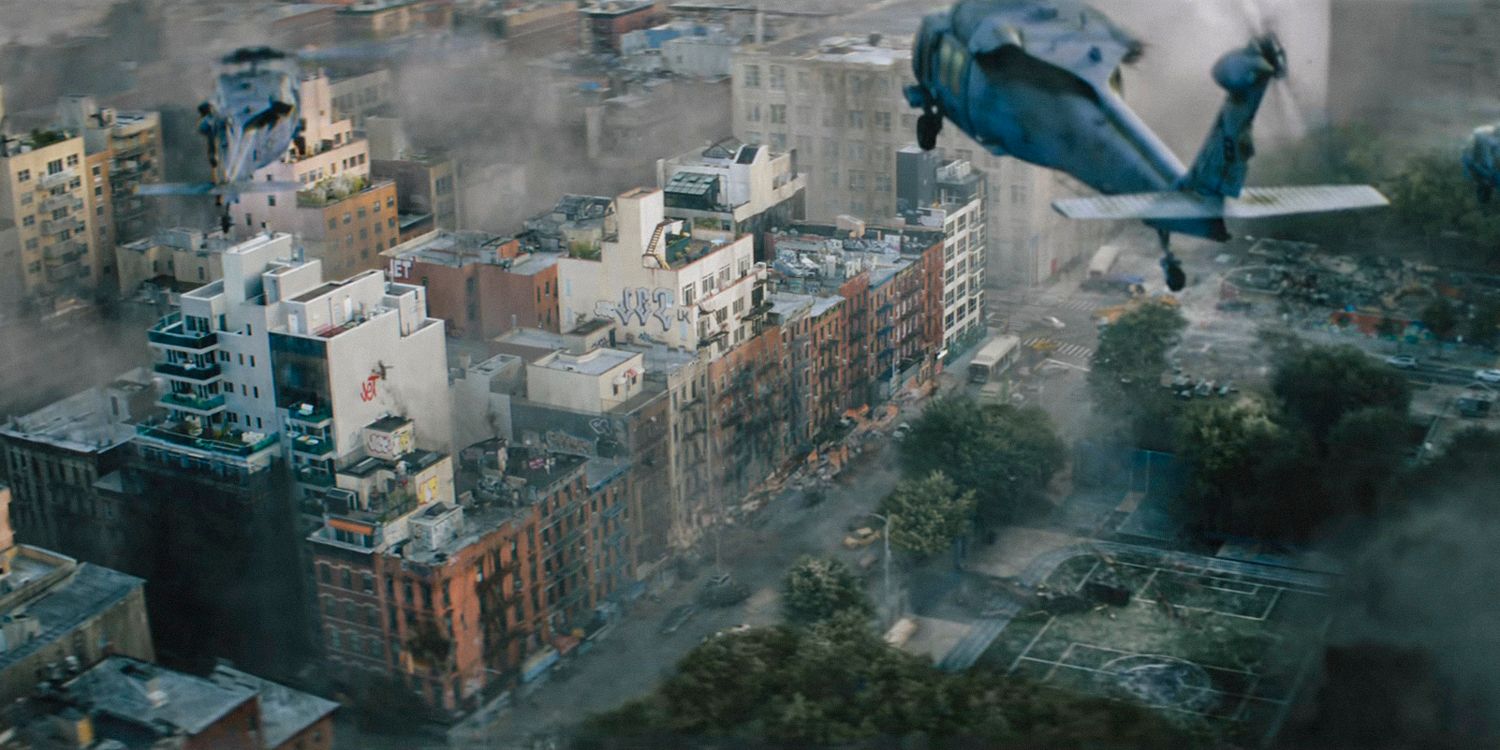 Military helicopters fly over the city as aliens climb the buildings in A Quiet Place: Day One