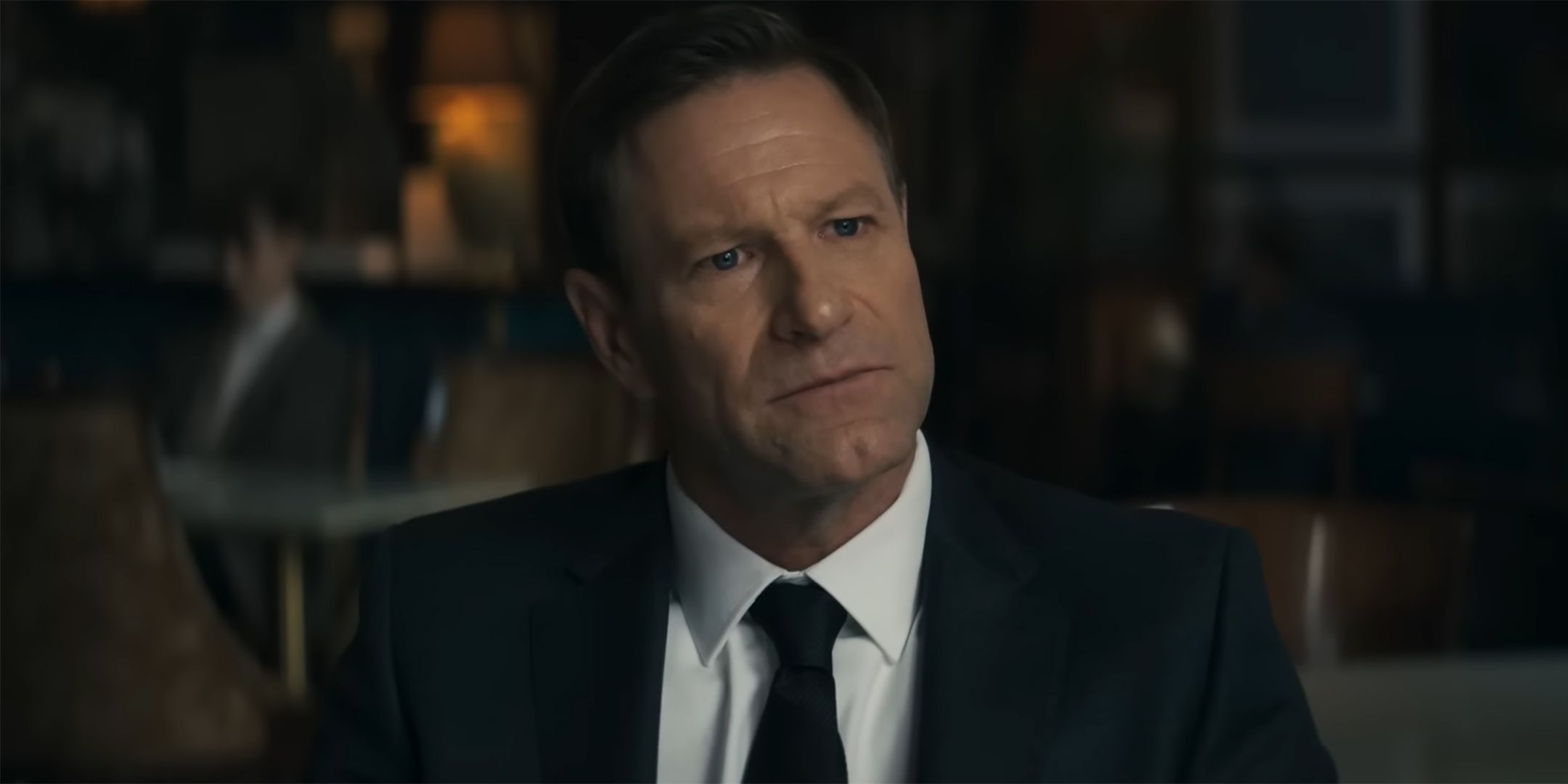Aaron Eckhart as Ben looking intrigued in Chief of Station