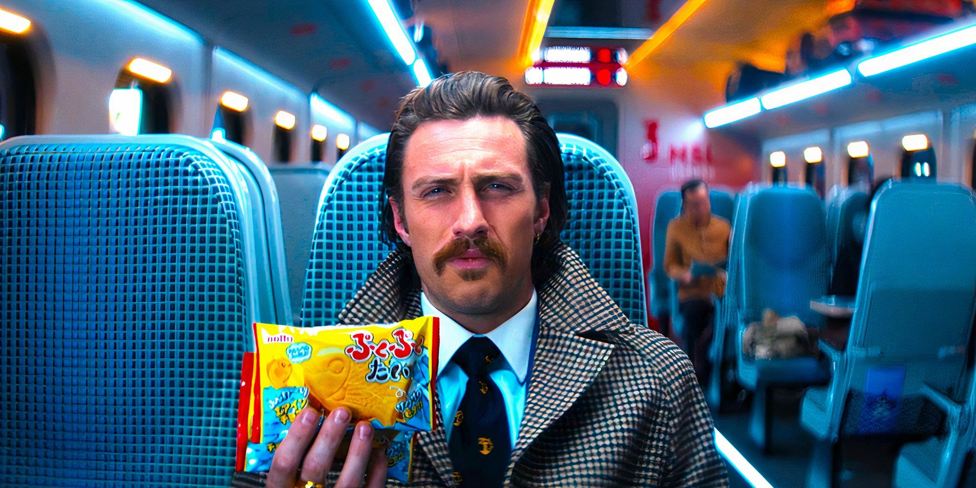 Aaron Taylor-Johnson sits in a train seat holding up a package of noodles while making a skeptical expression in a scene from Bullet Train