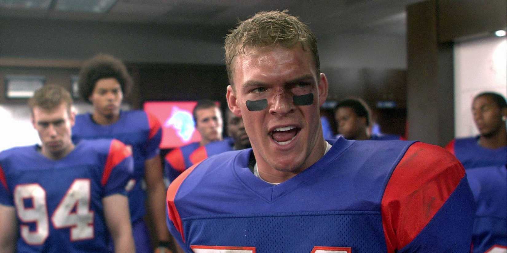 Alan Ritchson as Thad yelling in the locker room in Blue Mountain State