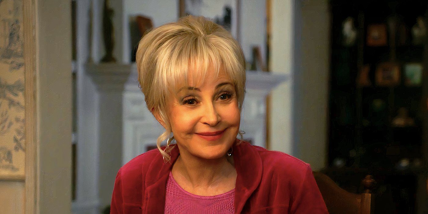 Annie Potts's Meemaw smiles at the dinner table in Young Sheldon season 7 episode 12