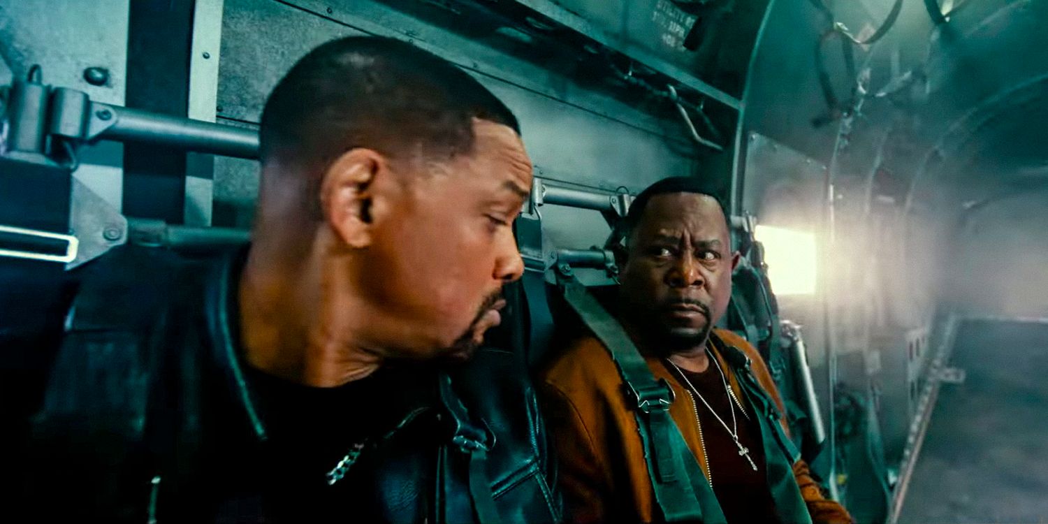 Martin Lawrence as Marcus and Will Smith as Mike look at each other aboard a military plane in Bad Boys: Ride or Die