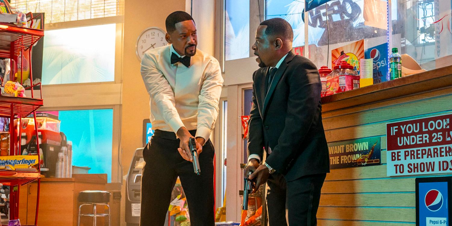 Marcus (Martin Lawrence) and Mike (Will Smith) holding their guns, look at each other before shooting in Bad Boys: Ride or Die