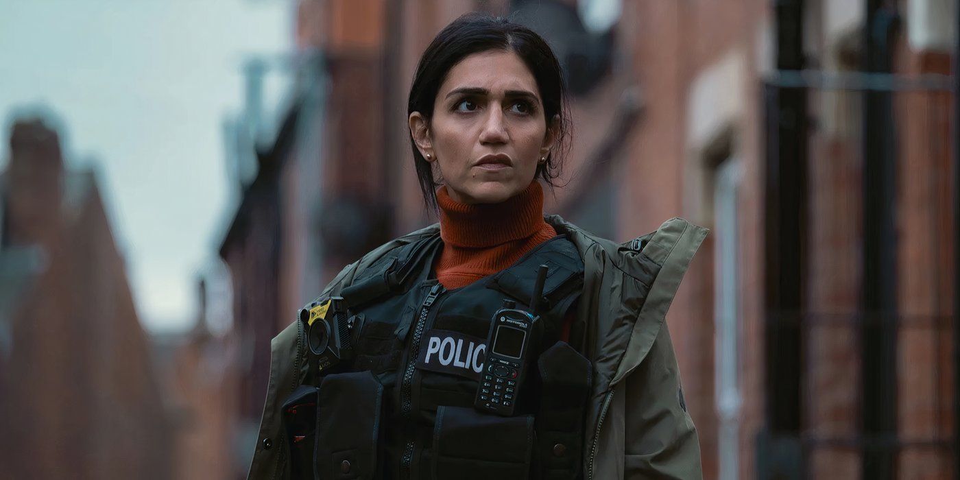 Leila Farzad looks concerned while wearing bulletproof vest and standing on the street