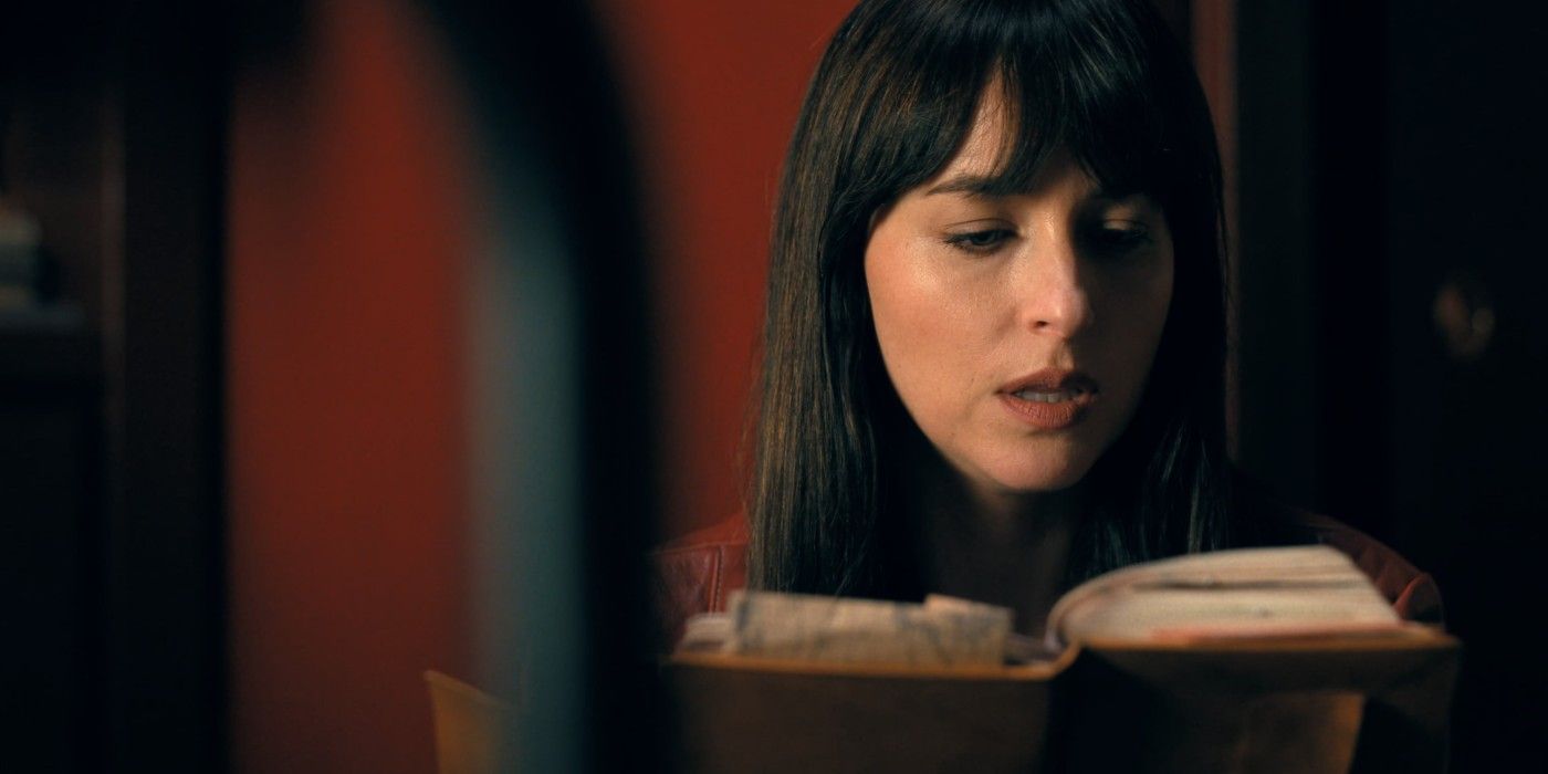 Cassie reading her mom's journal in Madame Web