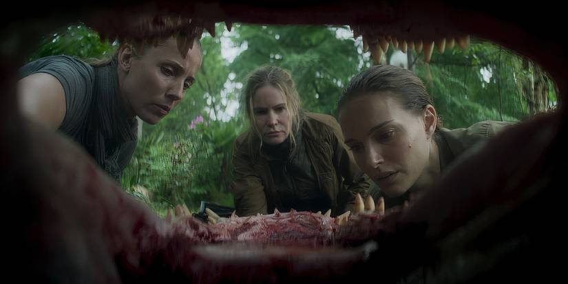 Natalie Portman and Jennifer Jason Leigh inspecting a mutated Alligator in Annihilation