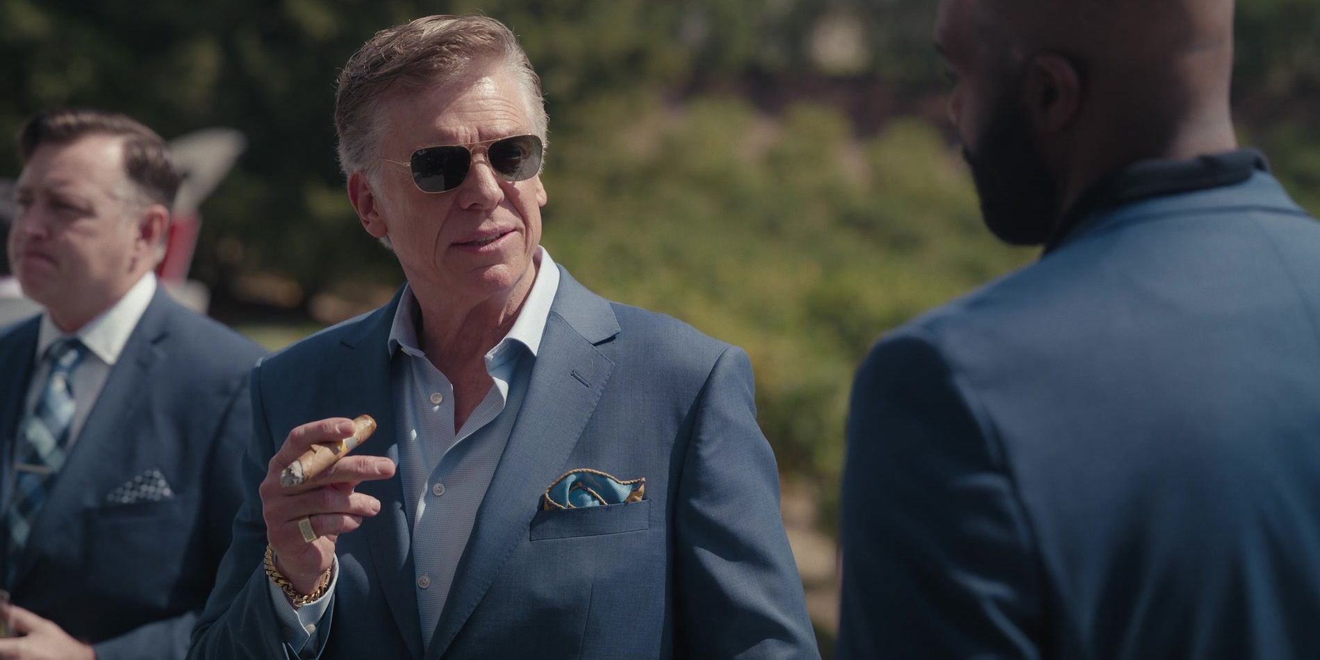 Christopher McDonald smoking a cigar in Hacks