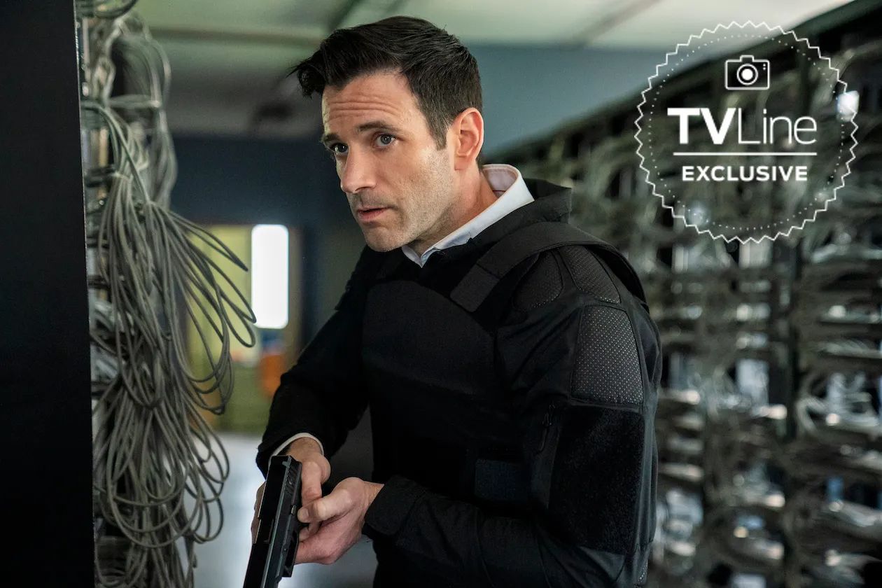 Colin Donnell as Brian Lange with a gun in FBI International season 3