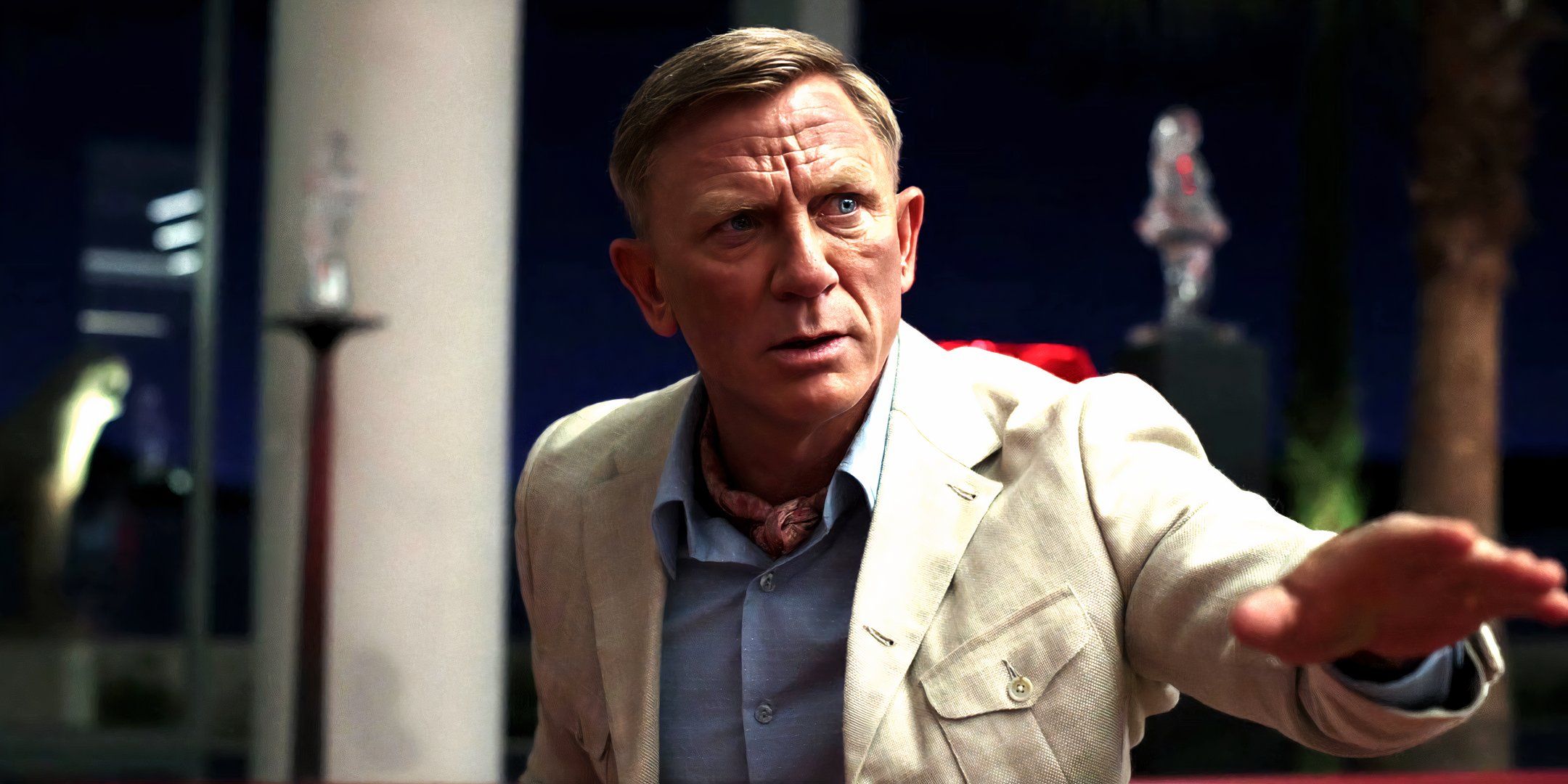 Daniel Craig as Benoit Blanc trying to calm everyone down in Glass Onion A Knives Out Mystery