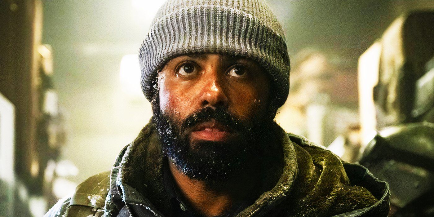 Daveed Diggs in a beanie covered in snow in Snowpiercer
