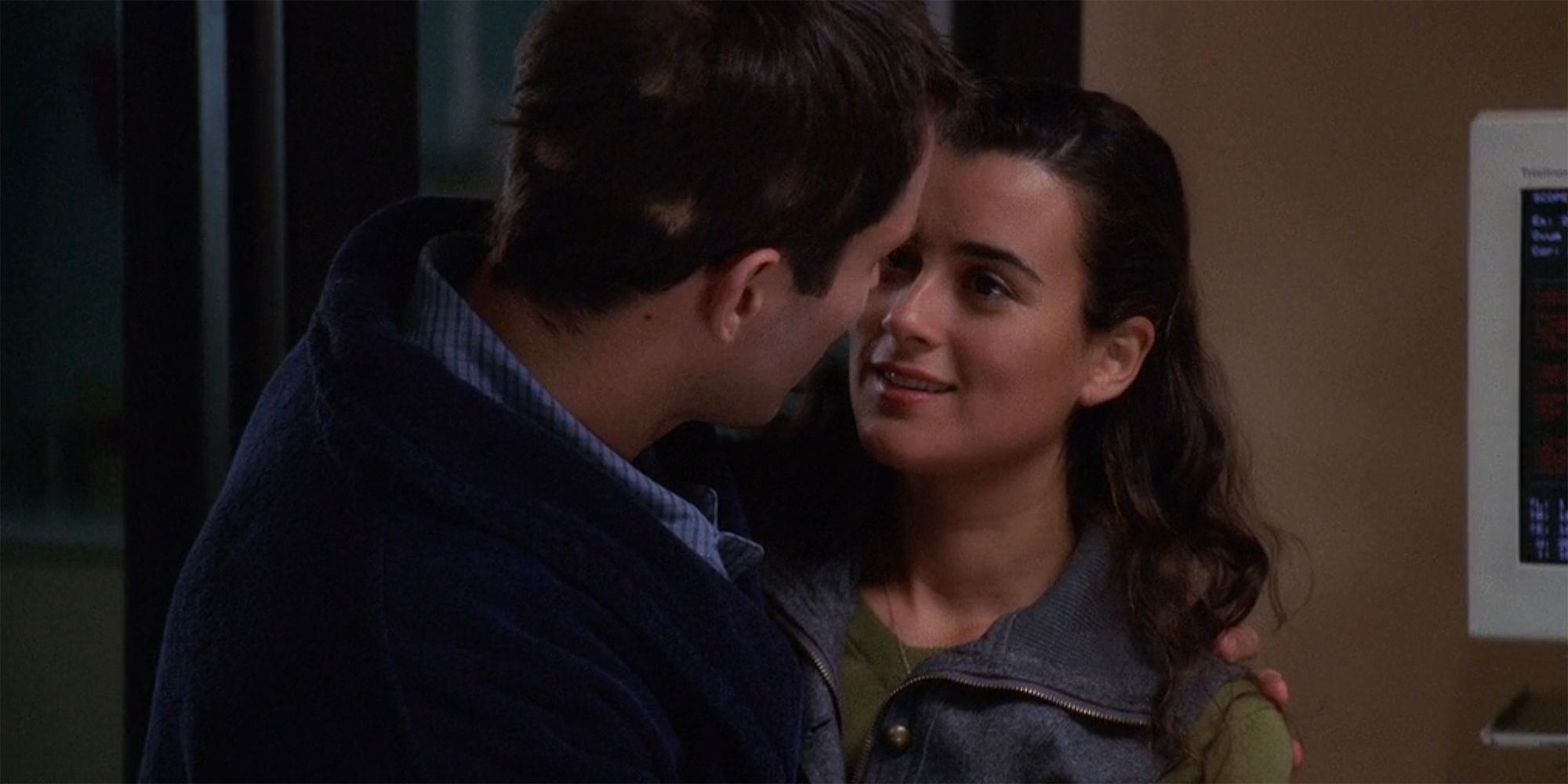 Ziva and their poisoned victim holding each other close in NCIS 